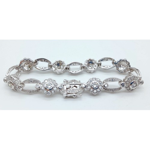 1164 - A VERY PRETTY STONE SET SILVER BRACELET WITH DOUBLE SAFETY CATCHES .   18.6gms   16cms