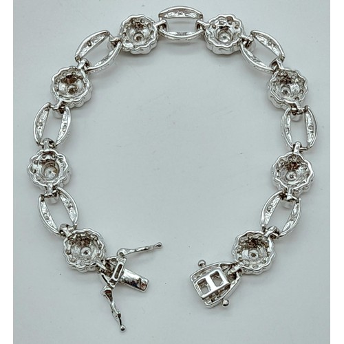 1164 - A VERY PRETTY STONE SET SILVER BRACELET WITH DOUBLE SAFETY CATCHES .   18.6gms   16cms