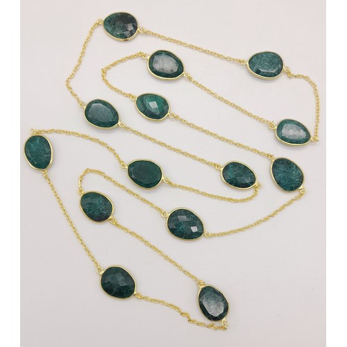 1312 - An Opera Length Gilded Necklace with Emerald Drops.