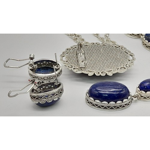 1136 - A Boxed Lapis Lazuli Jewellery Suite. Opera length necklace with pendant, oval brooch - 5cm and earr... 