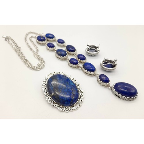 1136 - A Boxed Lapis Lazuli Jewellery Suite. Opera length necklace with pendant, oval brooch - 5cm and earr... 