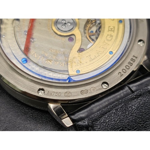 82 - An A. Lange and Sohne 18K Gold Automatic Gents Watch. Black leather strap and gold buckle. 18k gold ... 