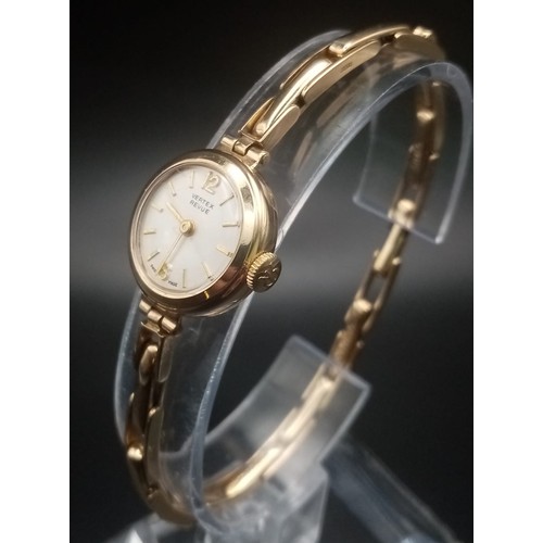 736 - A Vintage Vertex Revue 9K Gold Watch. Gold expandable bracelet and case - 18mm. White dial. Mechanic... 