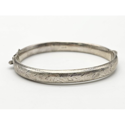 1488 - Four Different Style Sterling Silver Bangles. 63g total weight