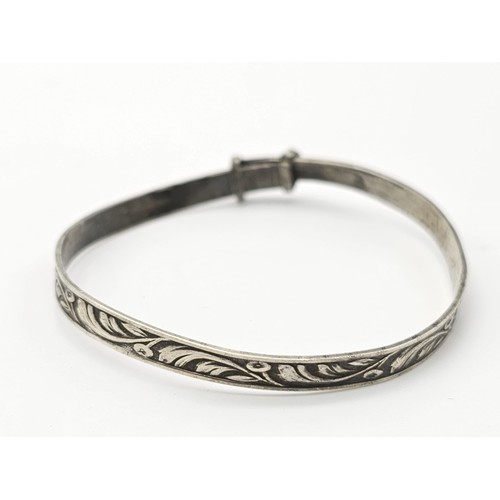 1488 - Four Different Style Sterling Silver Bangles. 63g total weight