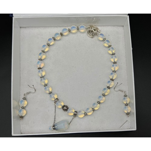 189 - An unusual opalite necklace with a miniature pendant perfume bottle and a matching pair of earrings ... 