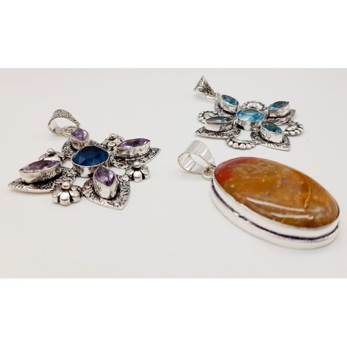 1790 - Three Multi-Coloured Gemstone Pendants set in White Metal.
Largest pendant - 6cm