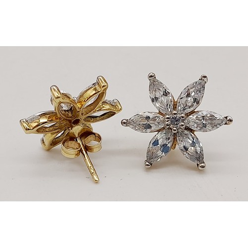 1279 - A Pair of Stunning 9K Gold Star Burst CZ Earrings. 2.6g total weight.