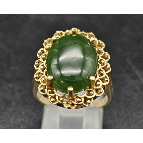 291 - A Fine polished cabbage leaf Jade ring set in 14K gold. 
Size P. 5.83g total weight.