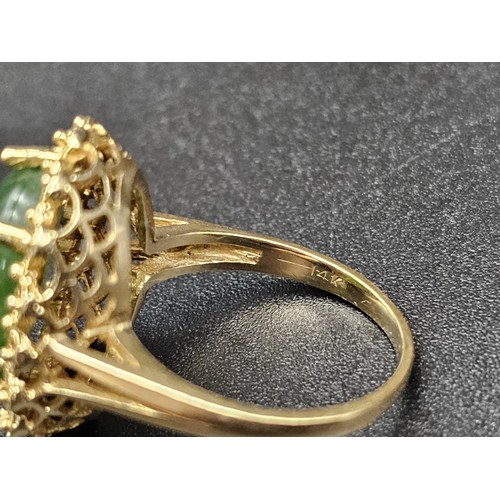 291 - A Fine polished cabbage leaf Jade ring set in 14K gold. 
Size P. 5.83g total weight.