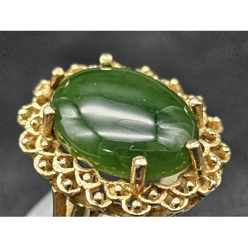 291 - A Fine polished cabbage leaf Jade ring set in 14K gold. 
Size P. 5.83g total weight.