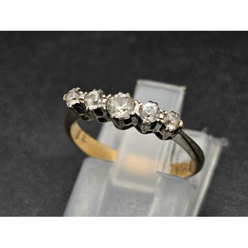 1314 - A diamond five stone ring set in yellow and white gold.
Size J. 1.63g total weight.