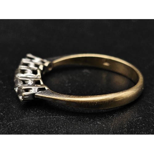 1314 - A diamond five stone ring set in yellow and white gold.
Size J. 1.63g total weight.