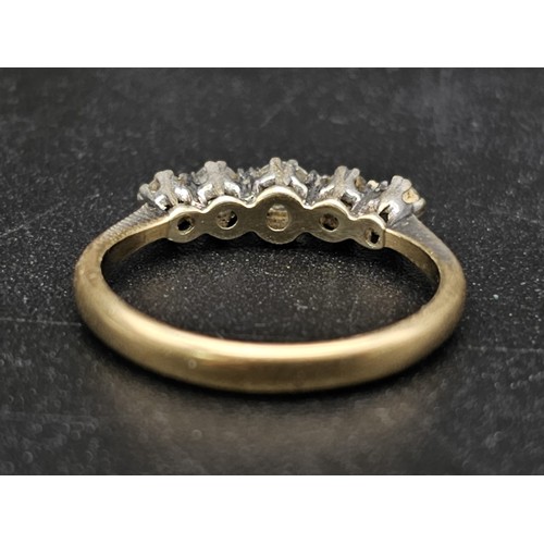 1314 - A diamond five stone ring set in yellow and white gold.
Size J. 1.63g total weight.