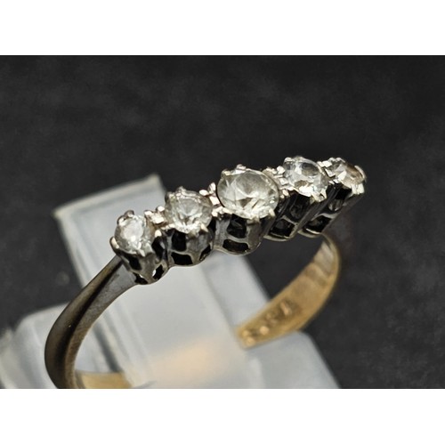 1314 - A diamond five stone ring set in yellow and white gold.
Size J. 1.63g total weight.