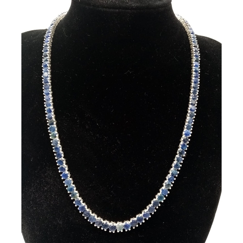 153 - A 925 Silver and Blue Sapphire Tennis Necklace. Total Weight 32grams. 44cm in Length.