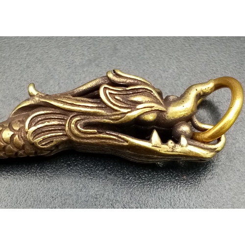 154 - A rare find: An Asian -probably Chinese- antique bronze, “ear spoon”, very ornate in the shape of a ... 