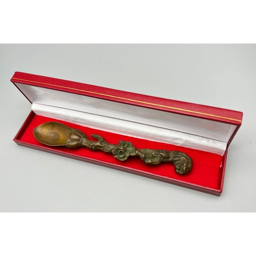 175 - An interesting, antique, Oriental, heavily ornate, bronze tea spoon. Length: 19 cm, weight: 192 g. P... 