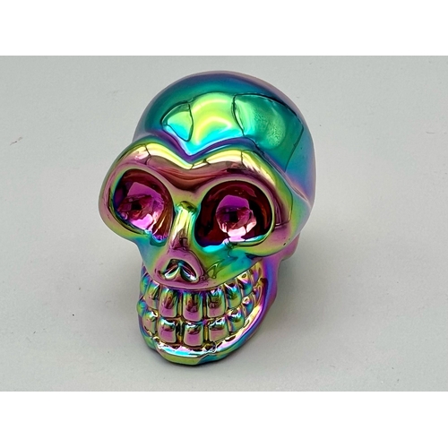 491 - A Titanium Covered Crystal Skull Figure. 5 x 5cm