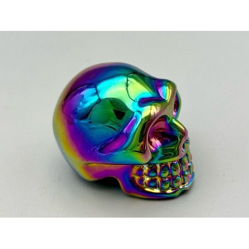 491 - A Titanium Covered Crystal Skull Figure. 5 x 5cm