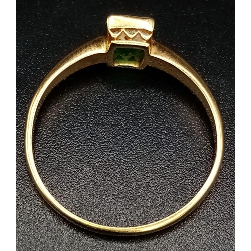 76 - An 18K Yellow Gold Emerald Solitaire Ring. Size O. 2.08g total weight.