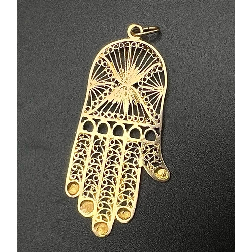 86 - A 9K Yellow Gold and Turquoise Hand of God Pendant. 5cm. 2.97g.