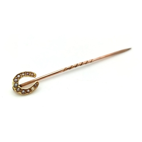 505 - An Antique Victorian 15K Gold and Horseshoe Pearl Stickpin.
5cm.