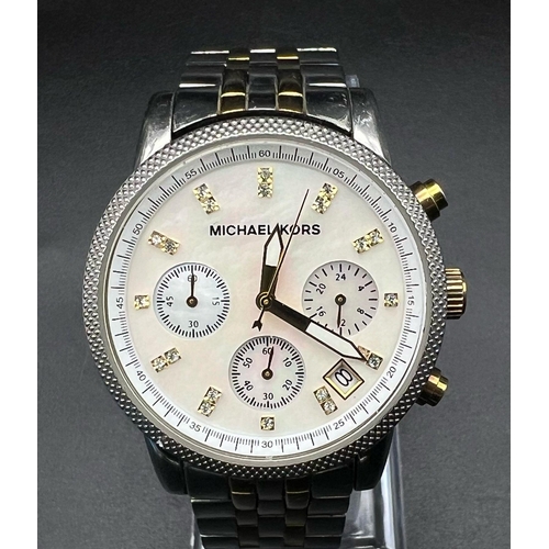 756 - A Michael Kors Chronograph Ladies Watch. Stainless steel strap and case - 37mm. Mother of pearl dial... 