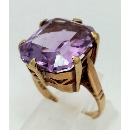 773 - A 9K Gold Amethyst Ring. Large, clean rectangular amethyst.
Size L. 5.57g total weight.