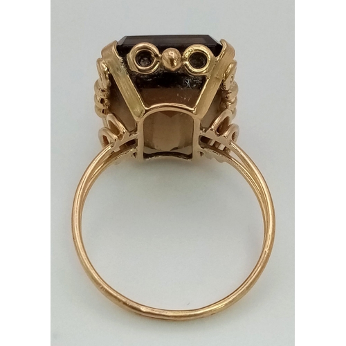 766 - A Vintage 18K Gold (tested) Smoky Quartz Ring. Rectangular step-cut 15ct smoky quartz. Size P. 5.91g... 