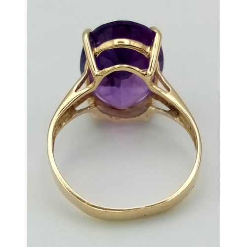 500 - A Vintage 14K Yellow Gold Amethyst Ring. Large, (3ct) clean, oval-cut amethyst. Size K. 2.64g total ... 