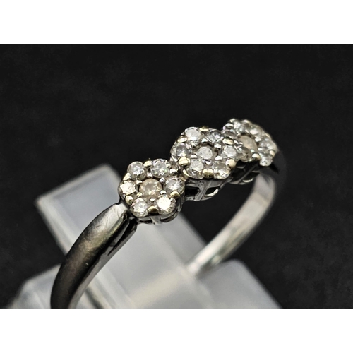 159 - 18k white gold diamond cluster trilogy ring 2.4g (dia:0.25ct) size M