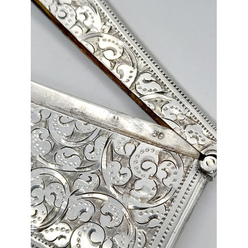 507 - An Antique 925 Silver Card Case. Swirl engraved decoration. Hallmarks for Birmingham 1898. 8 x 4cm. ... 