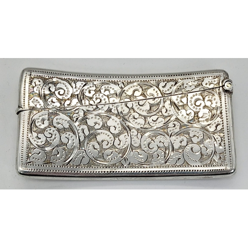 507 - An Antique 925 Silver Card Case. Swirl engraved decoration. Hallmarks for Birmingham 1898. 8 x 4cm. ... 