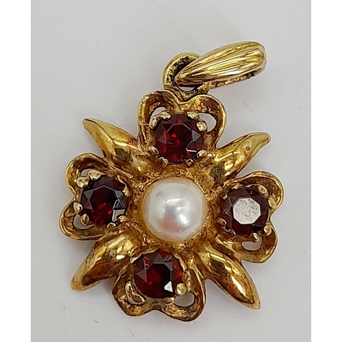 1292 - A Vintage 9k Yellow Gold Garnet and Pearl Pendant. 2cm. 1.71g total weight.