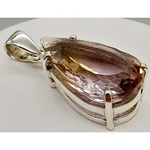 1291 - An Ametrine Pear-Shape Pendant and Matching Oval Ring. Set in 925 Silver with over 30ct of Ametrine.... 