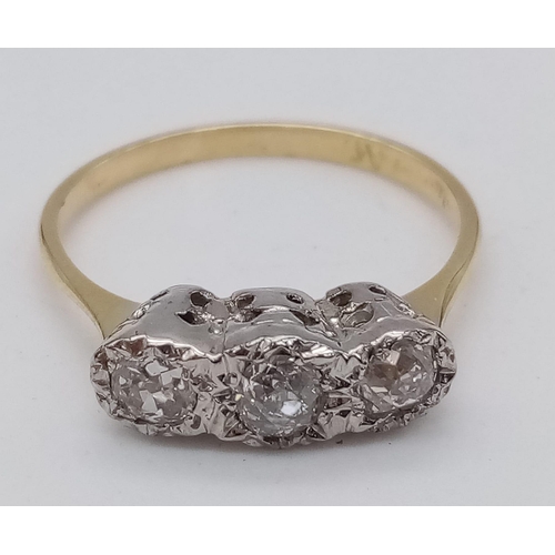 25 - A VINTAGE 18K GOLD RING IN LOVELY CONDITION WITH 3 QUALITY DIAMONDS SET IN PLATINIUM .  2.82gms   si... 