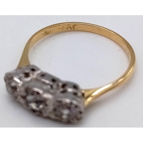 25 - A VINTAGE 18K GOLD RING IN LOVELY CONDITION WITH 3 QUALITY DIAMONDS SET IN PLATINIUM .  2.82gms   si... 