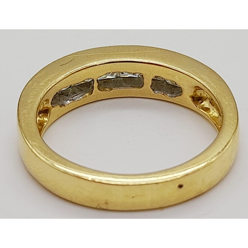 44 - An 18 K yellow gold ring with seven quality, princes cut diamonds (0.60 carats). Ring size: N, weigh... 