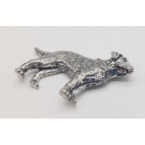 1099 - A sterling silver pendant in the shape of a dog. Length: 42 mm, weight: 7.4 g.