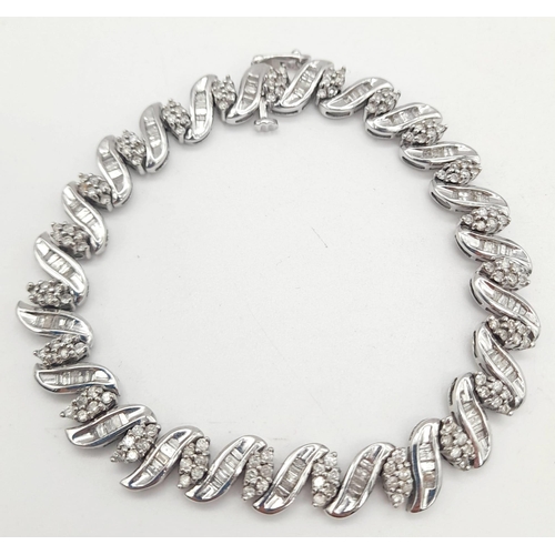 13 - A 14 K white gold bracelet with diamonds (2.50 carats). Length: 18 cm, weight: 15.3 g.