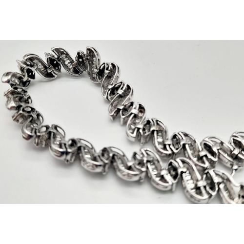 13 - A 14 K white gold bracelet with diamonds (2.50 carats). Length: 18 cm, weight: 15.3 g.