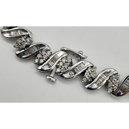 13 - A 14 K white gold bracelet with diamonds (2.50 carats). Length: 18 cm, weight: 15.3 g.