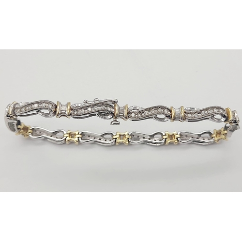 65 - A 14 K yellow and white gold bracelet with diamonds (1.10 carats).Length: 18 cm, weight: 13.1 g.