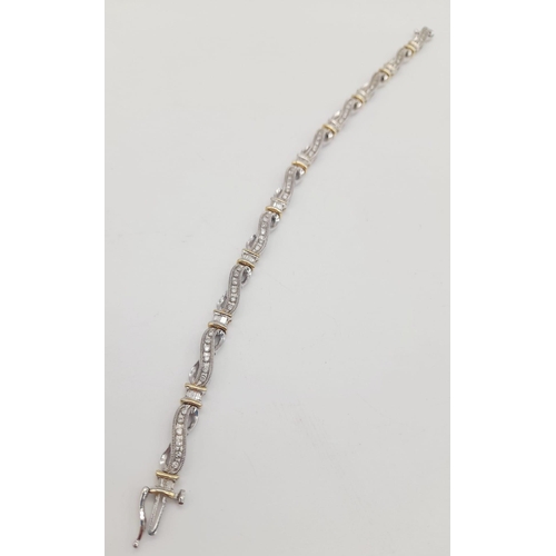 65 - A 14 K yellow and white gold bracelet with diamonds (1.10 carats).Length: 18 cm, weight: 13.1 g.