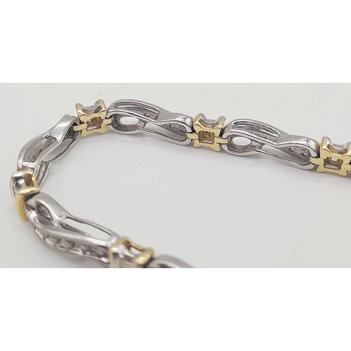 65 - A 14 K yellow and white gold bracelet with diamonds (1.10 carats).Length: 18 cm, weight: 13.1 g.