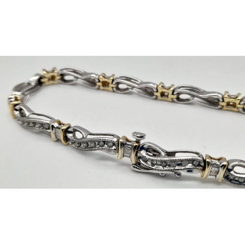 65 - A 14 K yellow and white gold bracelet with diamonds (1.10 carats).Length: 18 cm, weight: 13.1 g.