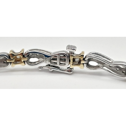 65 - A 14 K yellow and white gold bracelet with diamonds (1.10 carats).Length: 18 cm, weight: 13.1 g.