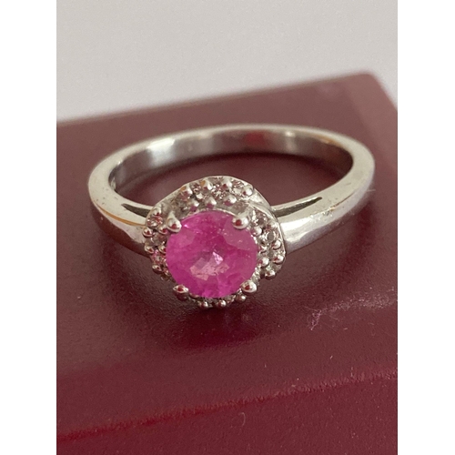 14 - Stunning RUBY and SILVER RING having a circular cushion cut RUBY mounted to top with Diamond surroun... 