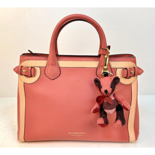 8 - A Burberry Red Leather Handbag. Two tone exterior with teddy bear mascot. Gold-tone hardware. Black ... 